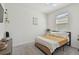 Cozy bedroom with natural light, comfortable furnishings, and soothing decor at 12517 Nantahala Run, Parrish, FL 34219