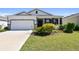 Charming home with a two-car garage, landscaped yard, and inviting curb appeal at 12517 Nantahala Run, Parrish, FL 34219