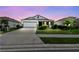 Beautiful single-story home featuring a well-manicured lawn and a two car garage on a concrete driveway at 12517 Nantahala Run, Parrish, FL 34219