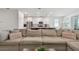 Open living room with a view of the kitchen and ample seating at 12517 Nantahala Run, Parrish, FL 34219