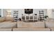 Bright living room with stylish shelves and open layout to the kitchen at 12517 Nantahala Run, Parrish, FL 34219
