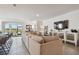 Comfortable living room open to the kitchen with tile flooring at 12517 Nantahala Run, Parrish, FL 34219