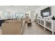 Open-concept living room featuring a large sectional sofa and decor at 12517 Nantahala Run, Parrish, FL 34219