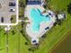 Overhead view of the community pool complete with palm trees, lounge chairs and umbrellas at 12517 Nantahala Run, Parrish, FL 34219