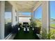 Inviting screened porch with comfortable seating and views of the serene lake at 12517 Nantahala Run, Parrish, FL 34219
