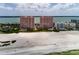 Breathtaking aerial view of beachfront condos with pool access and beautiful sandy beach at 1310 Gulf Blvd # 6C, Clearwater Beach, FL 33767