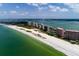 Panoramic aerial view capturing beachfront properties along a scenic coastline with clear blue waters at 1310 Gulf Blvd # 6C, Clearwater Beach, FL 33767