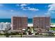 Condo complex with lush landscaping, tennis courts, ocean views, and beach access at 1310 Gulf Blvd # 6C, Clearwater Beach, FL 33767