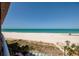 Expansive beach and ocean views from a high-rise balcony, complemented by luxurious beachfront amenities at 1310 Gulf Blvd # 6C, Clearwater Beach, FL 33767