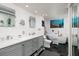 Luxurious bathroom with a soaking tub, double vanity, modern finishes, and tiled floor at 1310 Gulf Blvd # 6C, Clearwater Beach, FL 33767