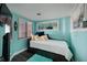 Bright bedroom features modern decor, fresh colors, a large window and a flat screen TV at 1310 Gulf Blvd # 6C, Clearwater Beach, FL 33767