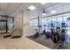 Well-equipped fitness center with various exercise machines and large windows at 1310 Gulf Blvd # 6C, Clearwater Beach, FL 33767