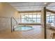 Inviting hot tub area with serene ocean views through expansive windows at 1310 Gulf Blvd # 6C, Clearwater Beach, FL 33767