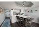 Modern kitchen has stainless steel appliances, breakfast bar and is open to living space beyond at 1310 Gulf Blvd # 6C, Clearwater Beach, FL 33767