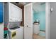 Convenient laundry area with stackable washer and dryer, and adjacent bathroom at 1310 Gulf Blvd # 6C, Clearwater Beach, FL 33767