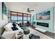 Living room boasts ocean views, modern furnishings, and a fireplace with large flat screen TV at 1310 Gulf Blvd # 6C, Clearwater Beach, FL 33767