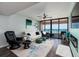 The living room has ocean views, modern furniture, and access to a balcony at 1310 Gulf Blvd # 6C, Clearwater Beach, FL 33767