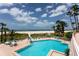 Stunning beachfront pool area with comfortable lounge seating, perfect for relaxing by the ocean at 1310 Gulf Blvd # 6C, Clearwater Beach, FL 33767