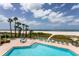 Inviting beachfront pool area with ample lounge seating, perfect for enjoying the coastal lifestyle at 1310 Gulf Blvd # 6C, Clearwater Beach, FL 33767