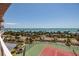 View of tennis courts and scenic ocean views from the balcony of the condo at 1310 Gulf Blvd # 6C, Clearwater Beach, FL 33767
