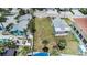 Panoramic aerial shot reveals a spacious empty lot; perfectly located near palm trees and neighborhood amenities at 13124 4Th E St, Madeira Beach, FL 33708