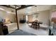 Unfinished living area with tile flooring, dining set, exposed studs, and lots of natural light at 13603 Red Birch Pl, Tampa, FL 33625