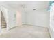 Bright bedroom offers neutral carpeting, a ceiling fan, and a large window with coverings at 1624 Lullwater Ln, Lutz, FL 33549