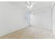 Carpeted bedroom featuring a ceiling fan and a window at 1624 Lullwater Ln, Lutz, FL 33549