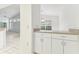 View from kitchen area looking to dining room with bright natural light at 1624 Lullwater Ln, Lutz, FL 33549