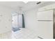Kitchen space featuring white appliances, a ceiling fan, and access to the patio at 1624 Lullwater Ln, Lutz, FL 33549