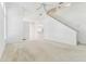Bright and open living room featuring neutral carpet flooring and staircase at 1624 Lullwater Ln, Lutz, FL 33549