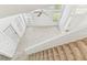 Sun-filled living room with high ceilings, lots of natural light and a carpeted staircase at 1624 Lullwater Ln, Lutz, FL 33549
