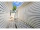 Private outdoor patio with wooden deck, fence and potted plants at 1624 Lullwater Ln, Lutz, FL 33549
