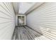 Private outdoor patio with wooden deck and sliding door entrance at 1624 Lullwater Ln, Lutz, FL 33549