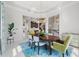 Elegant dining room with a chandelier, modern decor, and an open view to the adjacent spaces at 16365 Redington Dr, Redington Beach, FL 33708