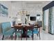 Open dining room with modern decor with views into the kitchen and living room at 16365 Redington Dr, Redington Beach, FL 33708