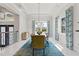 Dining room features an elegant light fixture, tray ceiling, and bright window views at 16365 Redington Dr, Redington Beach, FL 33708