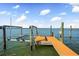 Private boat dock and lift providing direct access to the water for boating and water activities at 16365 Redington Dr, Redington Beach, FL 33708