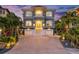 Stunning two-story home boasting a private balcony, two-car garage and meticulous landscaping at 16365 Redington Dr, Redington Beach, FL 33708