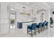 Bright kitchen with dual islands, blue breakfast bar, stylish decor, and marble countertops at 16365 Redington Dr, Redington Beach, FL 33708