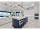 Bright kitchen features dual islands, modern appliances, and access to the living area at 16365 Redington Dr, Redington Beach, FL 33708