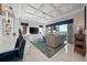 Spacious living room with coffered ceilings, water views, and comfortable seating at 16365 Redington Dr, Redington Beach, FL 33708