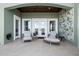 Outdoor patio seating area with chairs, table, and view of the lake at 16365 Redington Dr, Redington Beach, FL 33708