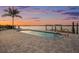 Beautiful swimming pool with a dock, lift and sunset views, perfect for waterfront living at 16365 Redington Dr, Redington Beach, FL 33708