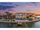 Stunning waterfront home boasts private pool, dock, and breathtaking sunset views in a luxurious coastal setting at 16365 Redington Dr, Redington Beach, FL 33708