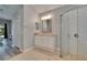Bright bathroom with a walk-in shower, vanity with granite countertop, and ample storage at 16367 Ashington Park Dr, Tampa, FL 33647