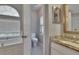 Bright bathroom featuring a bathtub, toilet, and vanity with granite countertop at 16367 Ashington Park Dr, Tampa, FL 33647