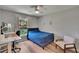 Bedroom with a bed, desk and chair, and large window providing natural light at 16367 Ashington Park Dr, Tampa, FL 33647