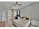 Bright bedroom with a ceiling fan, desk, and ensuite bathroom offering a relaxing retreat at 16367 Ashington Park Dr, Tampa, FL 33647