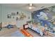 ' bedroom with twin beds, decorative wall art, and a ceiling fan at 16367 Ashington Park Dr, Tampa, FL 33647